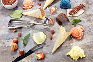 Set of ice cream scoops of different colors and flavours with berries and fruits