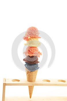 Set of ice cream scoops of different colors and flavours with berries and fruits