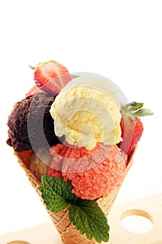 Set of ice cream scoops of different colors and flavours with berries and fruits