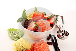 Set of ice cream scoops of different colors and flavours with berries and fruits