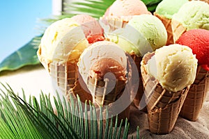 Set of ice cream scoops of different colors and flavours with berries and fruits