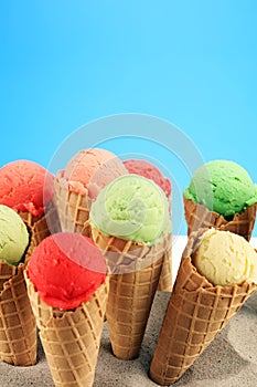 Set of ice cream scoops of different colors and flavours with berries and fruits