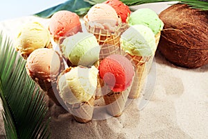 Set of ice cream scoops of different colors and flavours with berries and fruits