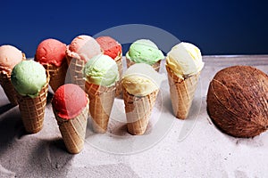 Set of ice cream scoops of different colors and flavours with berries and fruits