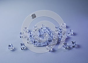 Set of ice cubes and dice falling on them