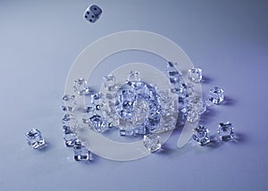 Set of ice cubes and dice falling on them