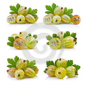 Set if ripe green gooseberries with leaves isolated on white