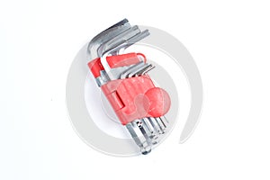 Set of imbus or Allen keys on a white background. Construction or repair tools in red plastic case