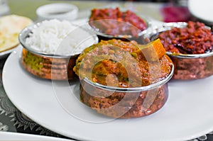 Set of Indian dish lunch including chicken masala curries and rice