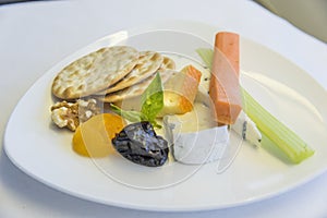 Set inflight meal appetizer on a tray, on a white table