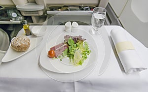 Set inflight meal sushi on a tray, on a white table