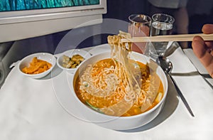 Set inflight meal on a tray, on a white table photo