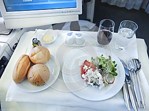 Set inflight meal on a tray, on a white table