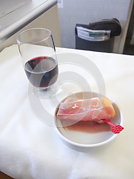 Set inflight meal on a tray, on a white table photo