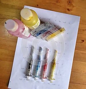 Set of Ink cartridges, refill paints in bottles and dirty syringes
