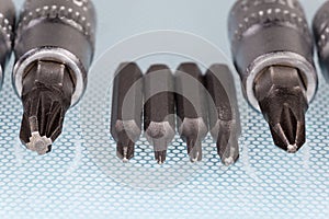 Sets of interchangeable crosspoint bits for screwdriver and mini screwdriver