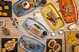 Set of international food recipes with Galician chicken, ventresca salad, cochinita pibil tacos, salad with shrimp, salmon tataki photo