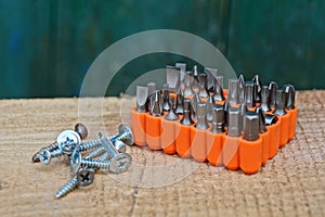 A set of iron bits for a screwdriver in an orange box