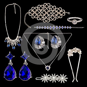Set of jewelry on a black background.