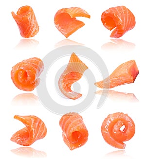 Set of juicy slices of salmon isolated on white background