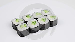 Set of kappa maki rolls spin on white background.