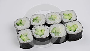 Set of kappa maki rolls spin on white background.