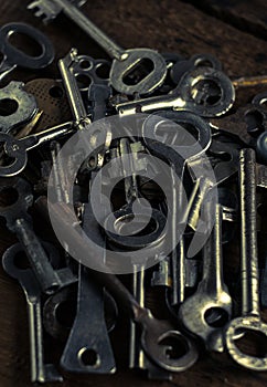 Set of keys on wood background. Tight focus with blur background