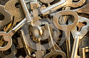 Set of keys on wood background. Tight focus with blur background