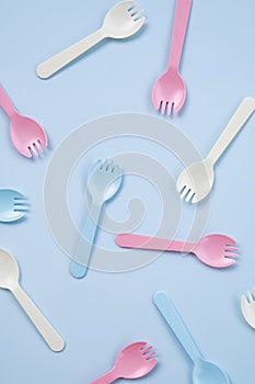 Set of kid forks lying on blue background