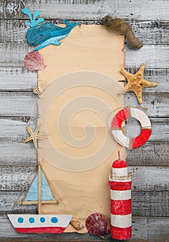 set of kids handcrafted boats, fish, nautical attributes and more on rough vintage wooden background and with blankpapyrus