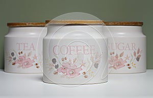A set of kitchen containers for sugar, coffee and tea