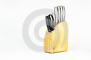 Set of kitchen knives with scissors on a white background.