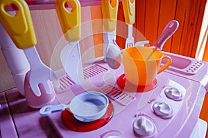 Set of Kitchen utensils. Children`s toys. Children`s kitchen game.Girl`s plastic kitchen for playing with various colors