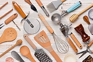 Set of kitchen utensils pattern on white wooden table background top view