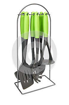 Set of kitchen utensils on a stand isolated on white background