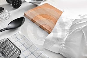 Set of kitchenware on white wooden table