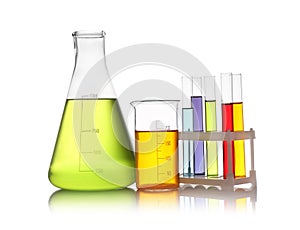 Set of lab glassware with  liquids isolated on white. Solution chemistry