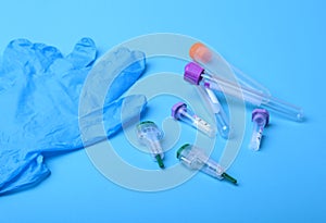 Set of laboratory supplies for blood test. Petri dish, Spectrophotometer cuvettes, blood test-tube. Selective focus.