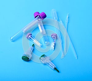 Set of laboratory supplies for blood test. Petri dish, Spectrophotometer cuvettes, blood test-tube. Selective focus.