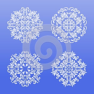 Set of lace snowflakes made of swirls and floral elements