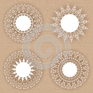 Set of lacy white frames on cardboard background