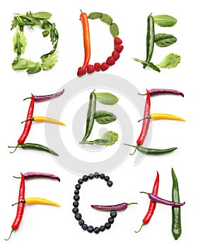 set of letter d e f g h made from orange yellow red purple chili pepper, blueberry, green salad, red raspberry