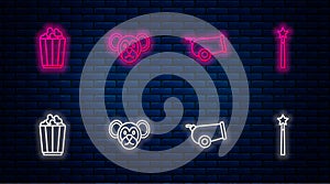 Set line Monkey, Cannon, Popcorn in box and Magic wand. Glowing neon icon on brick wall. Vector