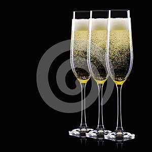 Set of luxury champagne glasses in a row isolated on a black background