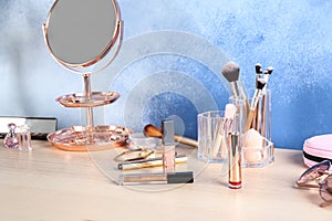 Set of cosmetics on dressing table