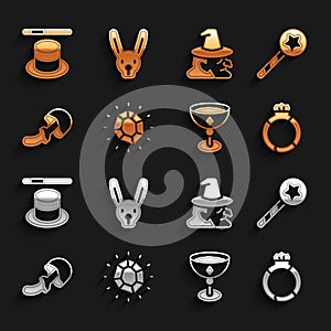 Set Magic stone, wand, ring with gem, Medieval goblet, Psilocybin mushroom, Witch, hat and Rabbit ears icon. Vector