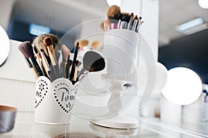 Set of make up brushes at beauty salon.