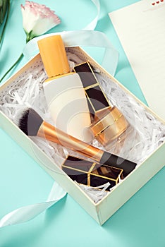 Set of make up cosmetics isolated on blue background