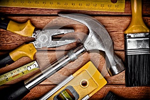 Set of manual tools on a wooden floor