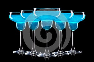 Set of Margarita cocktails with blue curacao isolated on a black background